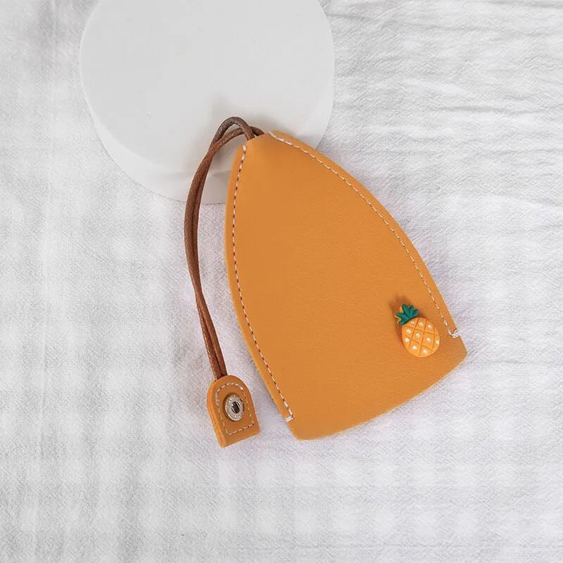 Colourful cartoon pull-out key case made from PU leather, showing the key extended from its protective sleeve.