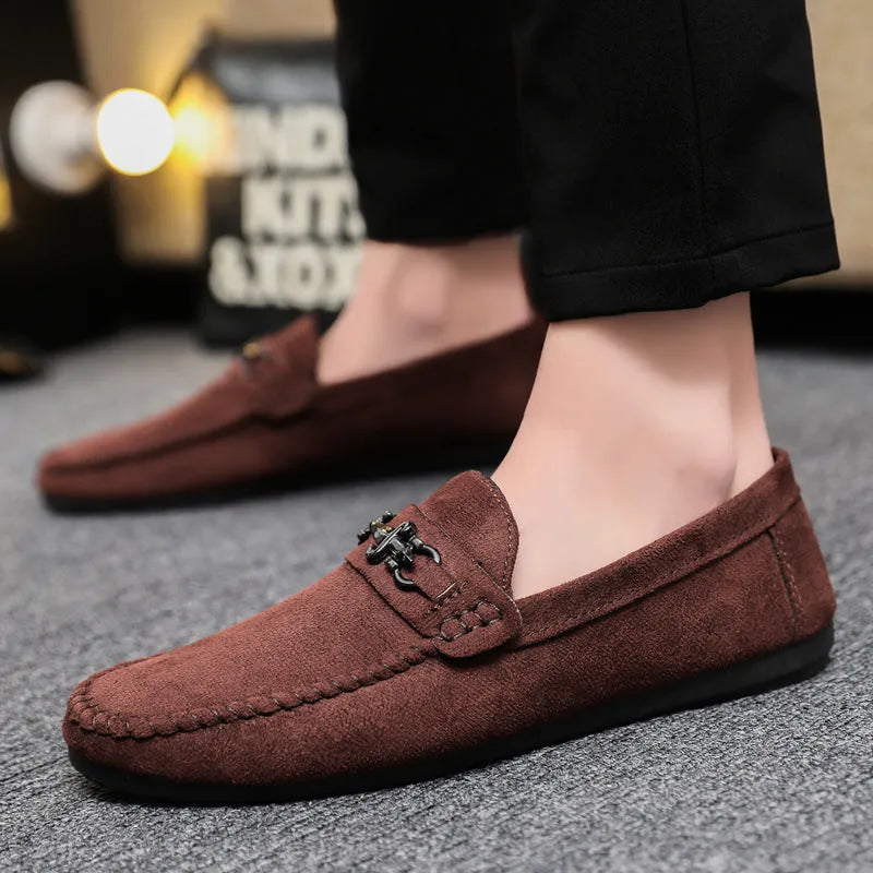 Men's black and brown waterproof slip-on loafers with round toe and rubber sole.