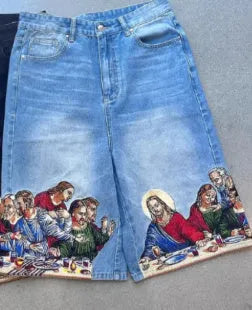 Men's blue cotton tapered shorts with Jesus print on back pocket, showing tapered leg design