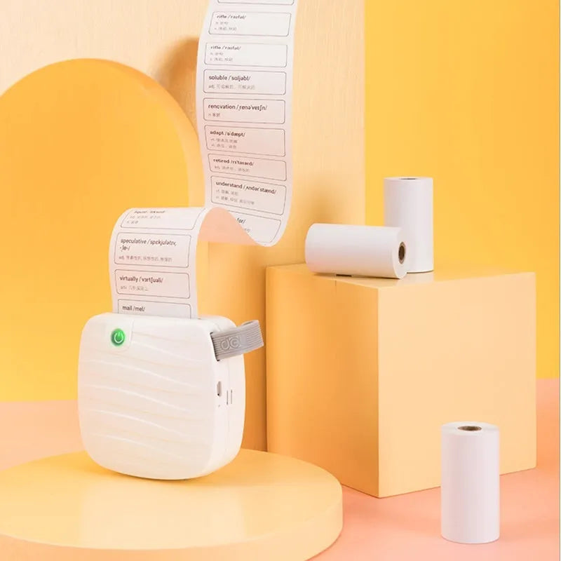 Three rolls of 57mm wide thermal paper on 30mm cores in an open box