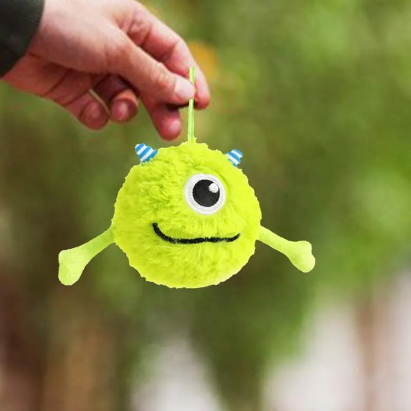 Green interactive dog toy ball with plush exterior and sound activation feature