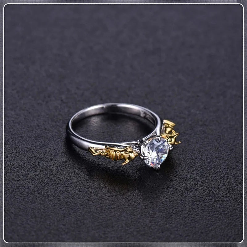 Copper crown crystal ring in black gold colour on a neutral background.