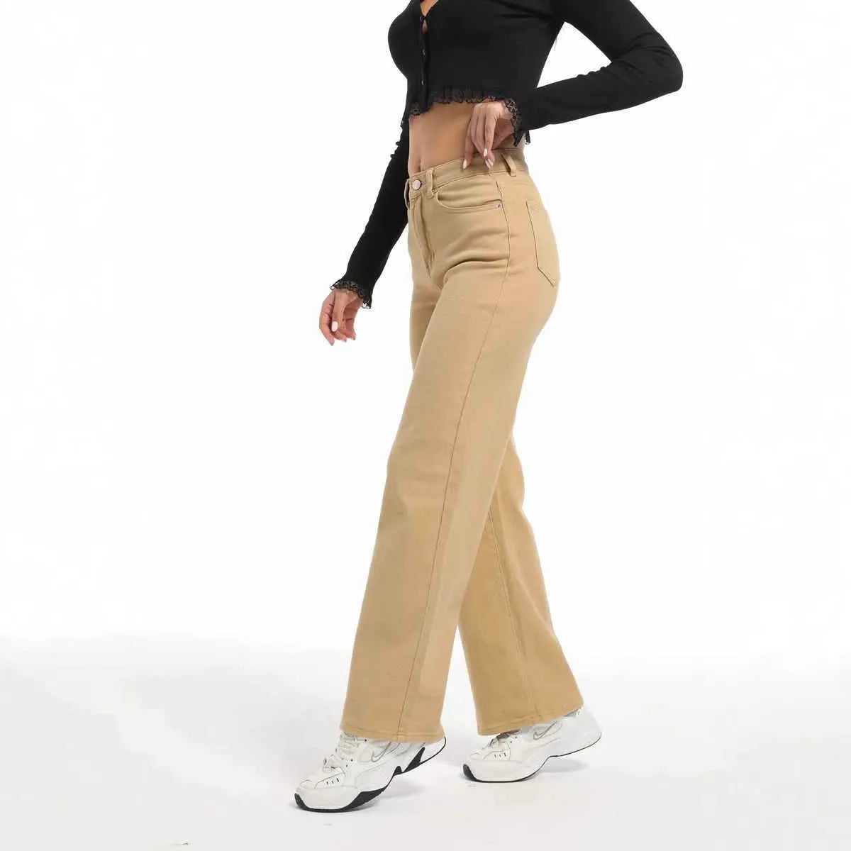 Women's high-waisted straight leg wide jeans in apricot colour on a hanger.