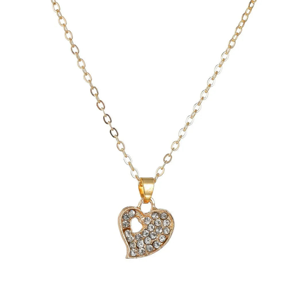 Gold electroplated women's jewellery set with love bell patterns including earrings, pendant and adjustable bracelet