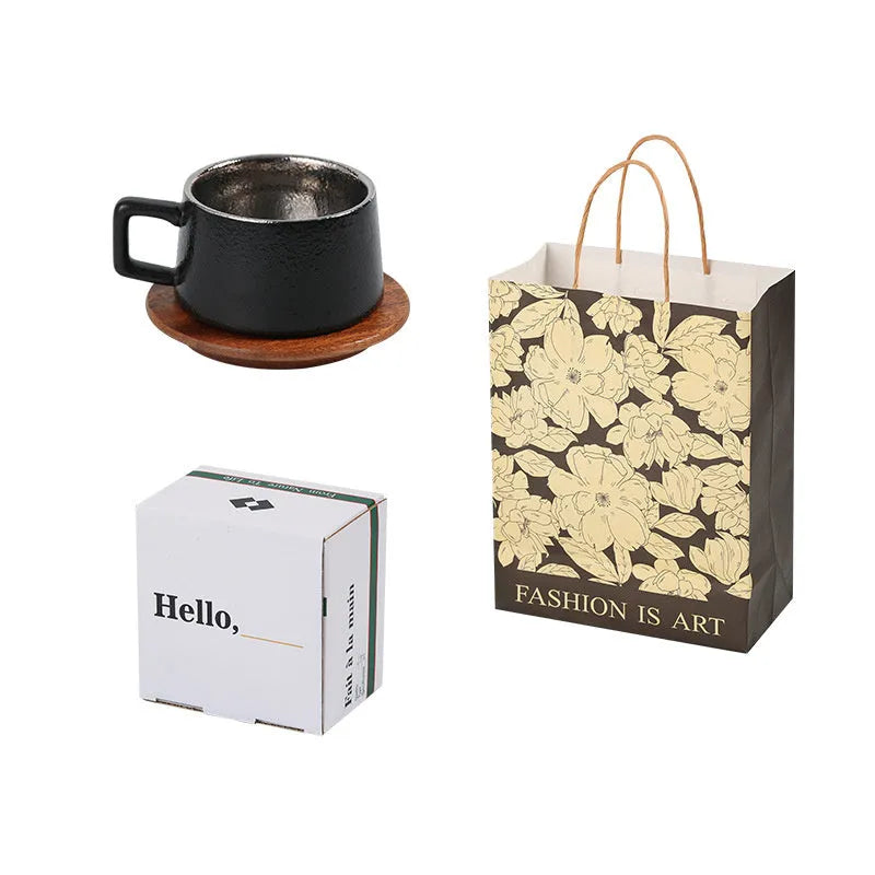 Gold and silver plated gift box next to a 250ml solid colour coffee travel mug.
