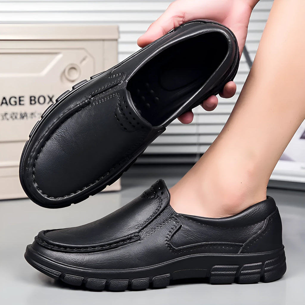 Men's black slip-on loafers with platform sole and round toe design