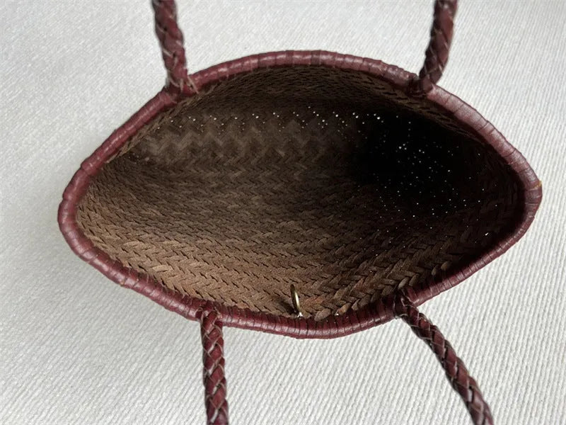 Handmade brown woven tote bag made from vintage top layer cowhide leather with a three-dimensional pocket.