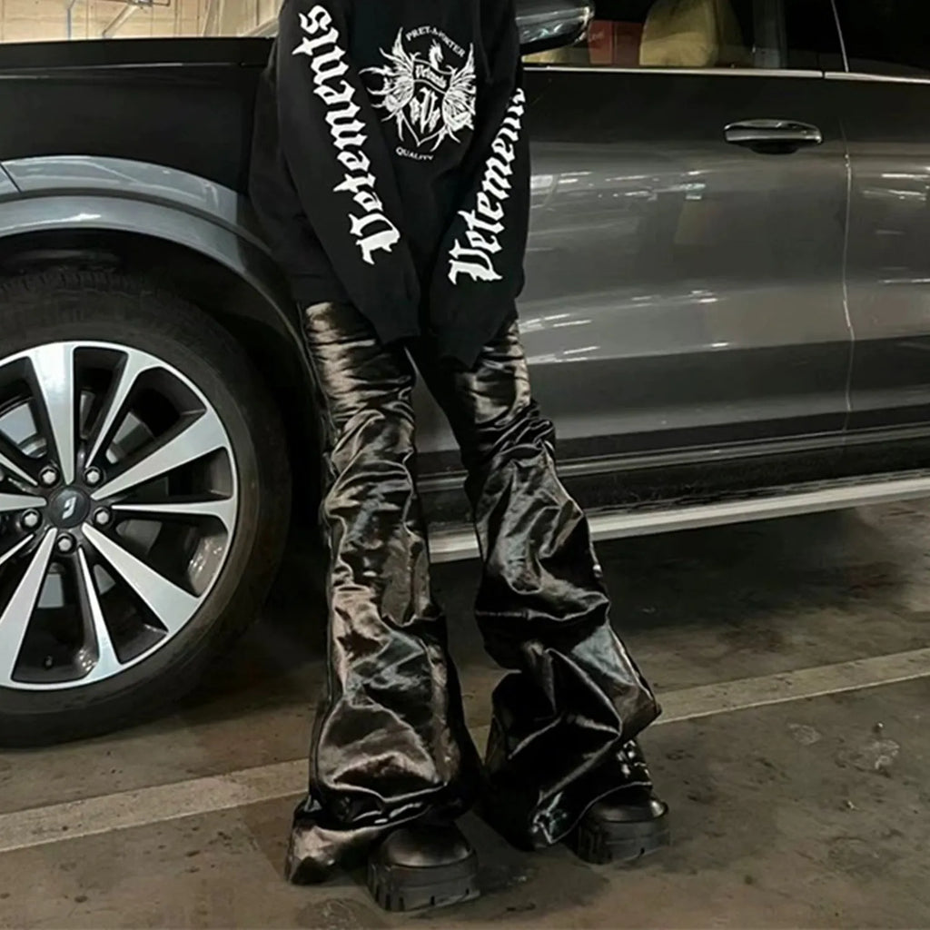 Black shiny patent leather skinny jeans with straight leg design and mid waist