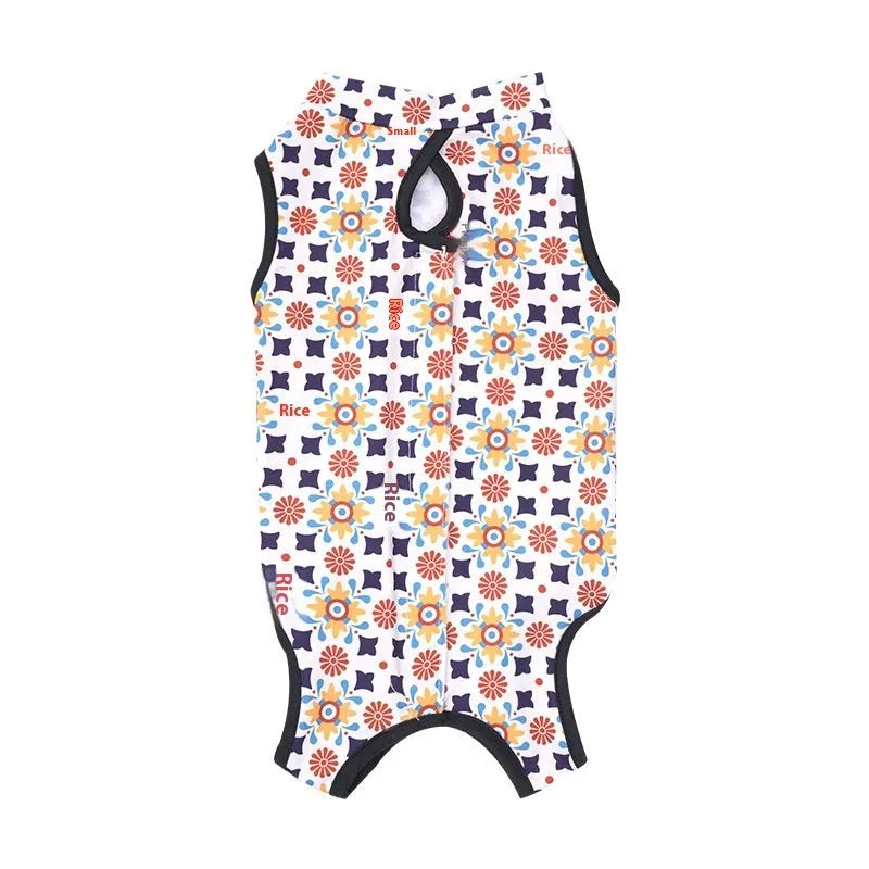 Cat wearing a sterilisation recovery suit with Velcro fastening and a printed pattern design