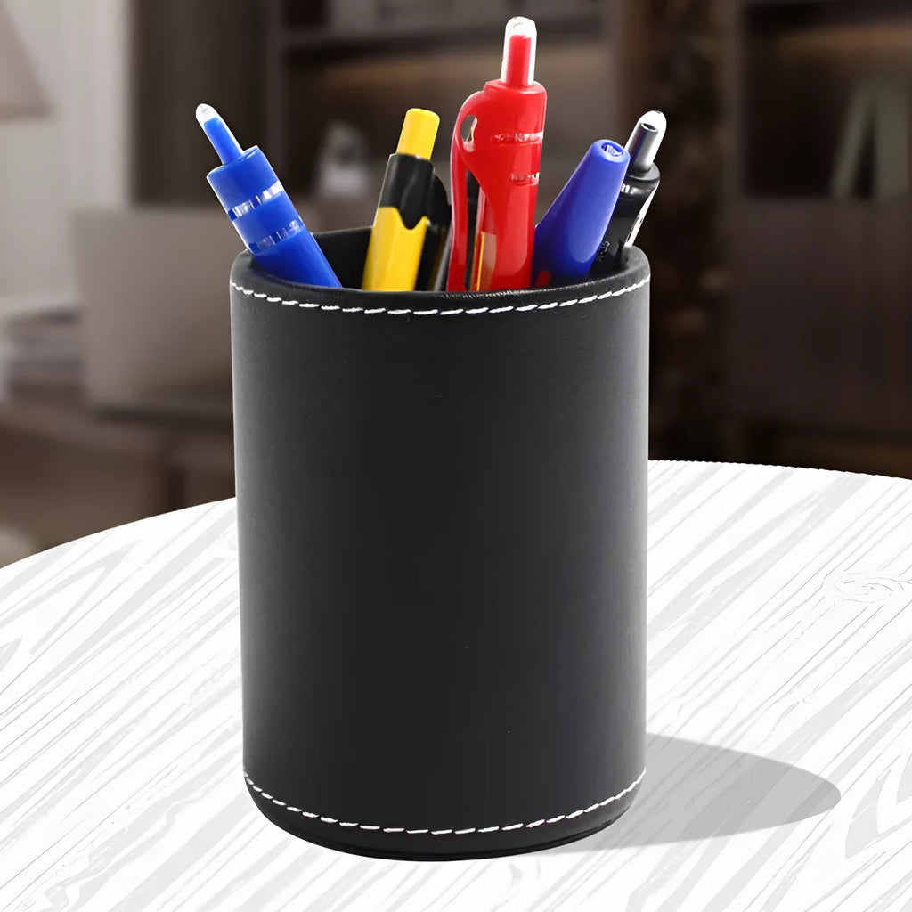 Round black leather pen container with 8.0cm diameter on wooden desk