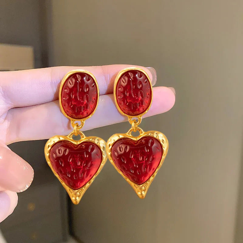 Silver pleated oval love heart stud earrings in alloy, showing green, purple, red, and yellow white colour options.