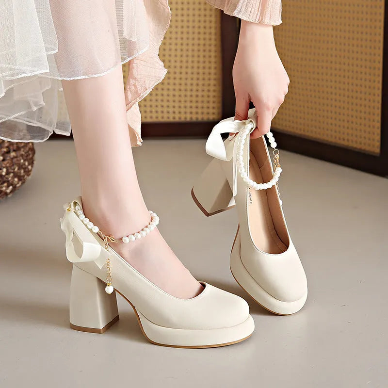 Women's beige Mary Jane shoes with chunky heel, pearl decoration, and ankle-strap buckle