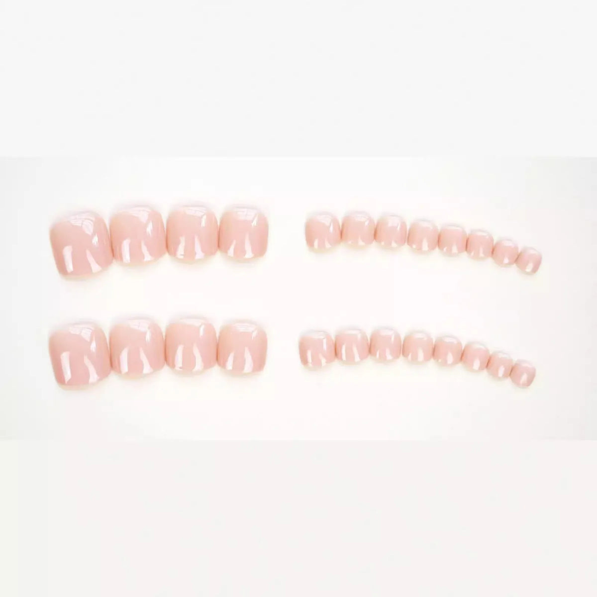 Finished plastic toe nail stickers in J-52 skin colour with adhesive glue for cosmetic application