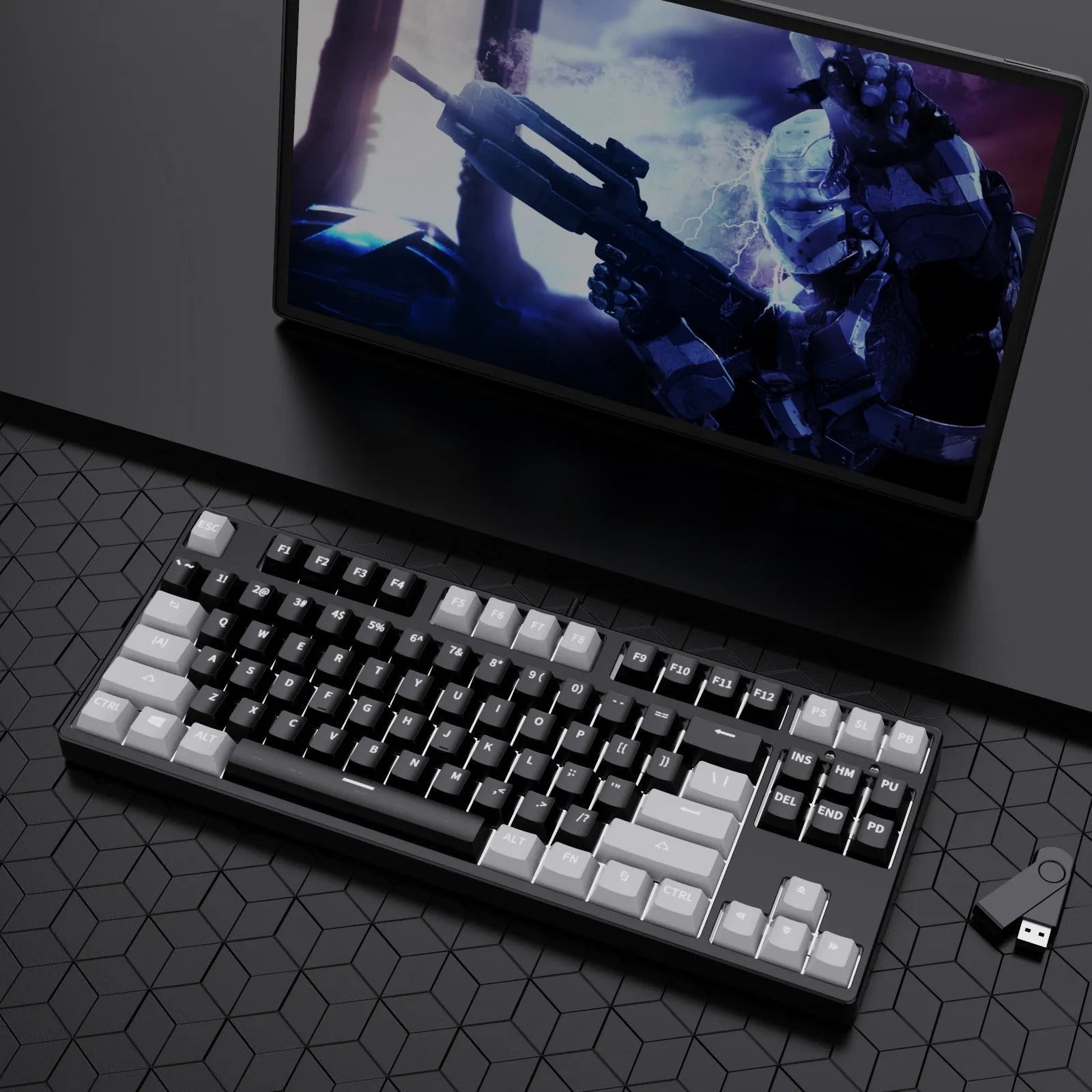 87 key wired mechanical keyboard with metal chassis shown in a black, orange, and yellow colour configuration.