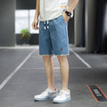 Korean style loose straight-leg beach shorts in 8905 green, available in sizes M to 8XL.