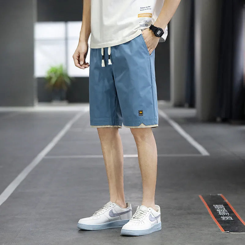 Korean style loose straight-leg beach shorts in 8905 green, available in sizes M to 8XL.