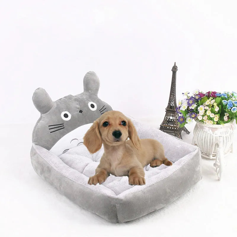 Cartoon-style sofa pet bed for small dogs and cats, shown in various colours.