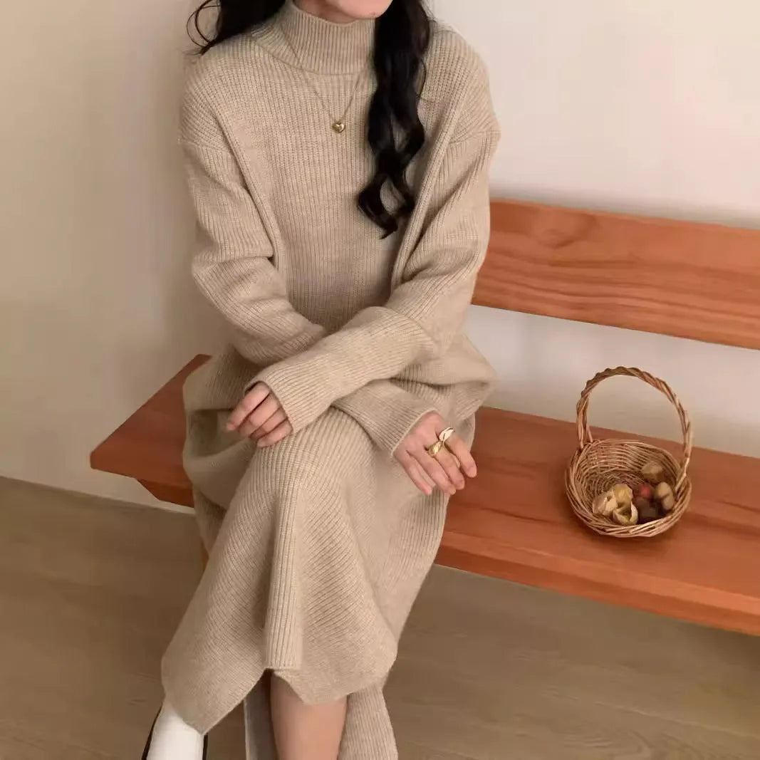 Half turtleneck knitted dress in graphite colour, knee-length with long sleeves and a high waist.