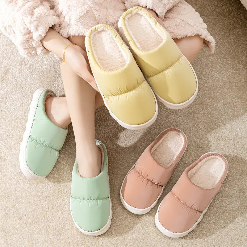 Blue couple's winter slippers with artificial leather upper, plush lining, and thick rubber anti-slip sole.