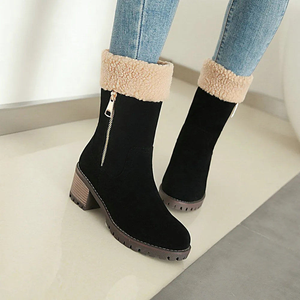 A pair of snow boots in black, shown with a soft plush lining and rubber insole.