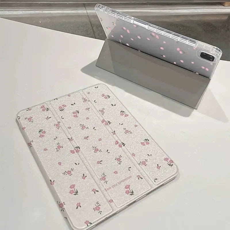 Transparent floral tri-fold tablet case for iPad showing magnetic closure and decorative pattern