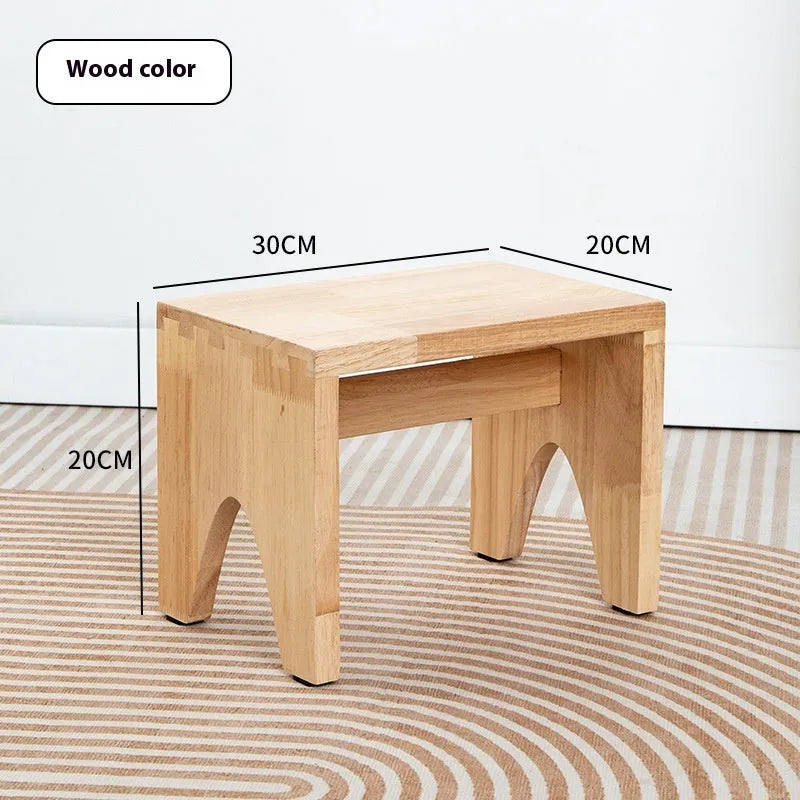 Distressed solid wood shoes changing stool with bracket structure for the living room.