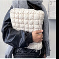 Large black and white nylon laptop bag showing cloud cotton storage compartment, suitable for 11 to 15.6 inch computers.