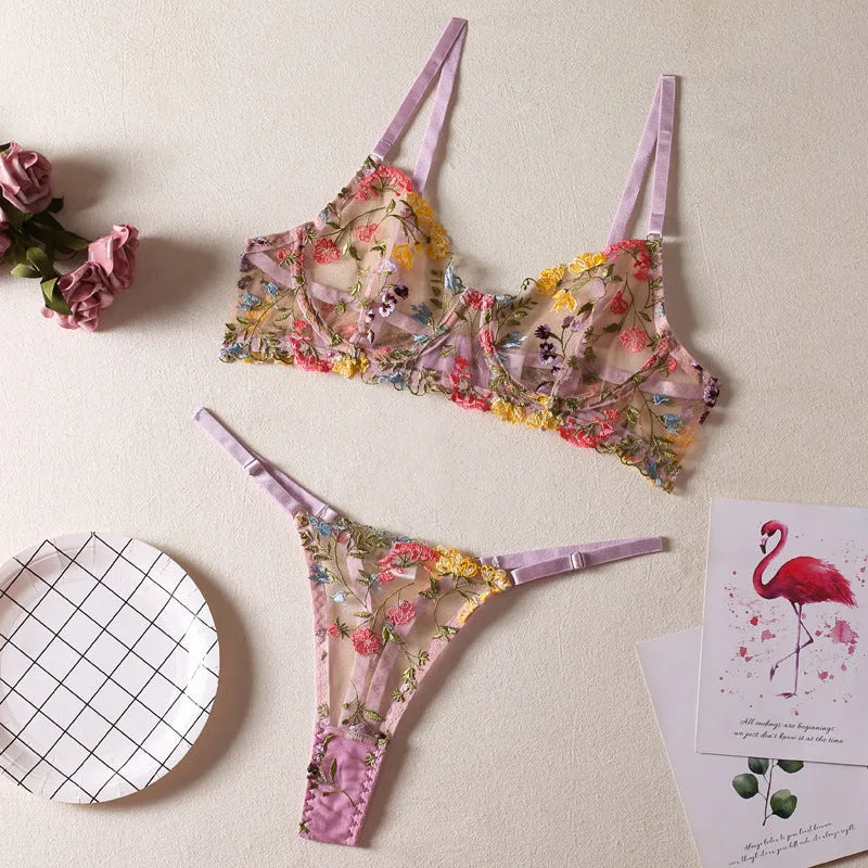 Floral mesh bra and matching T-back briefs set with a steel ring detail, shown in skin colour.