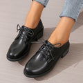 Black women's leather shoes with chunky heel, rubber sole, and low-top design for work and casual wear