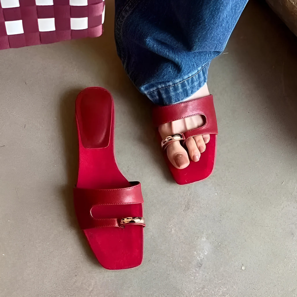 Square toe leather outdoor slipper in multiple colours on a plain background.