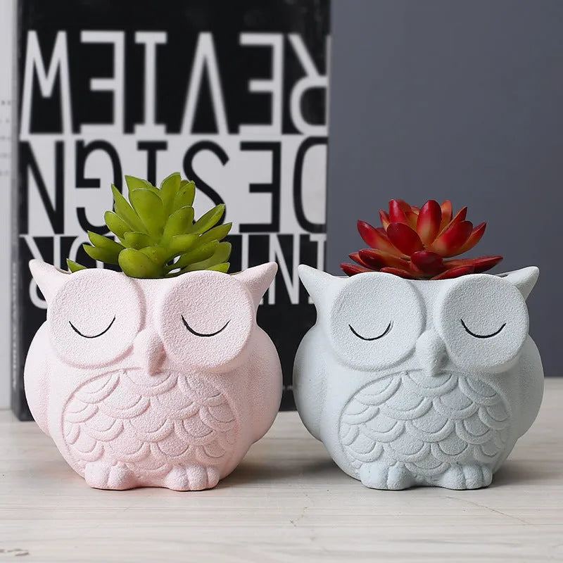 Handmade frosted ceramic owl planter for small succulents, shown in light pink.