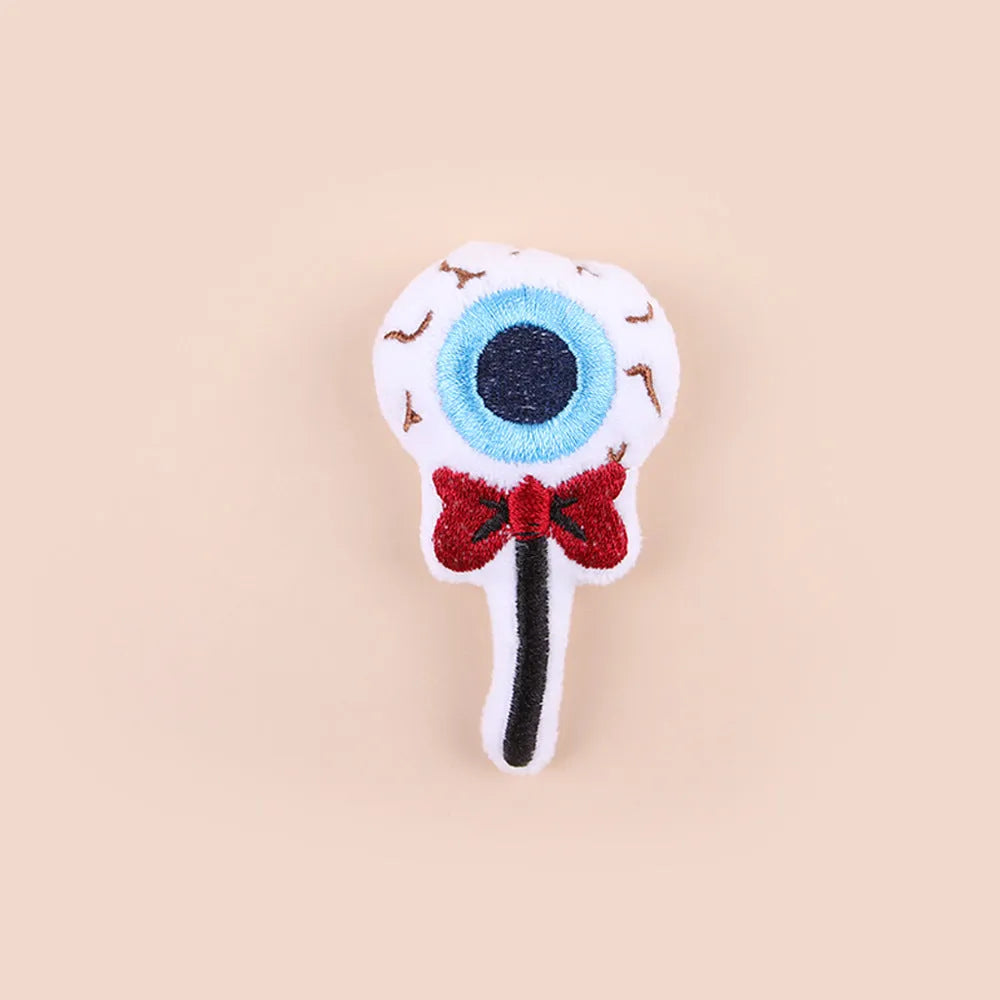 Small cat teaser wand toy with plush candy-themed attachment for interactive pet play