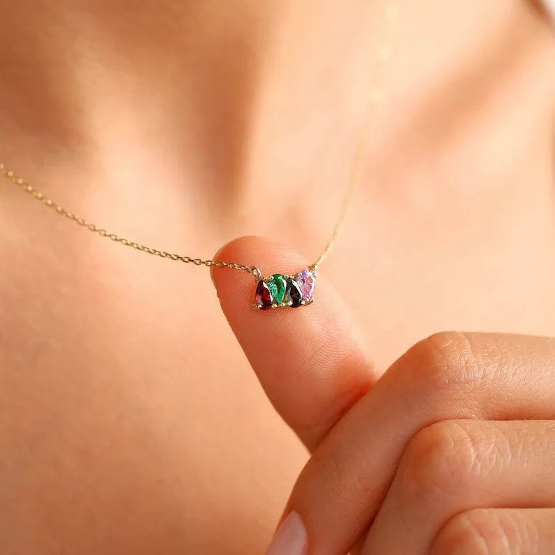 Close-up of a zircon stone birth month pendant on a titanium steel clavicle chain in rose gold finish.