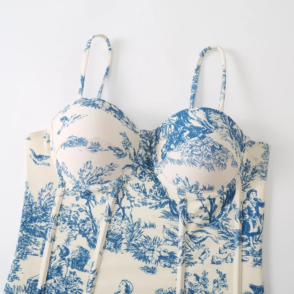 Women's blue patterned one-piece swimsuit with a skirt, made from polyester fabric.