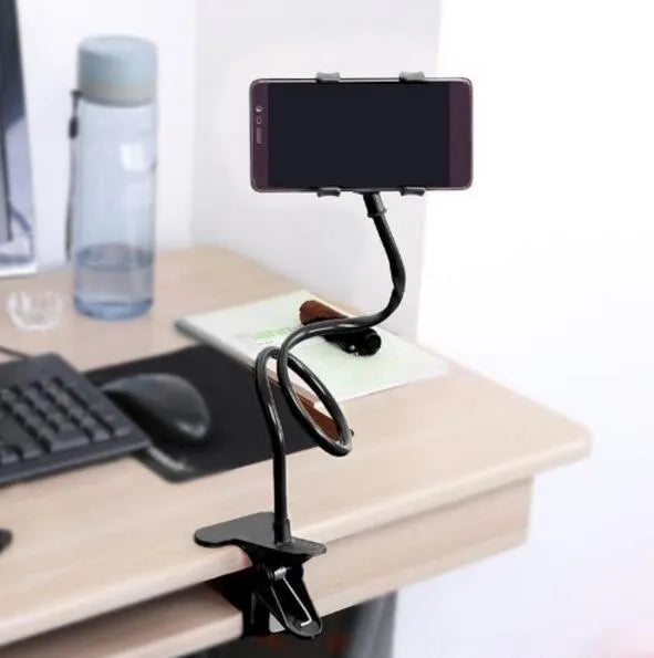 Black flexible long-arm phone holder with V-clip mounted on bed frame showing adjustable angles