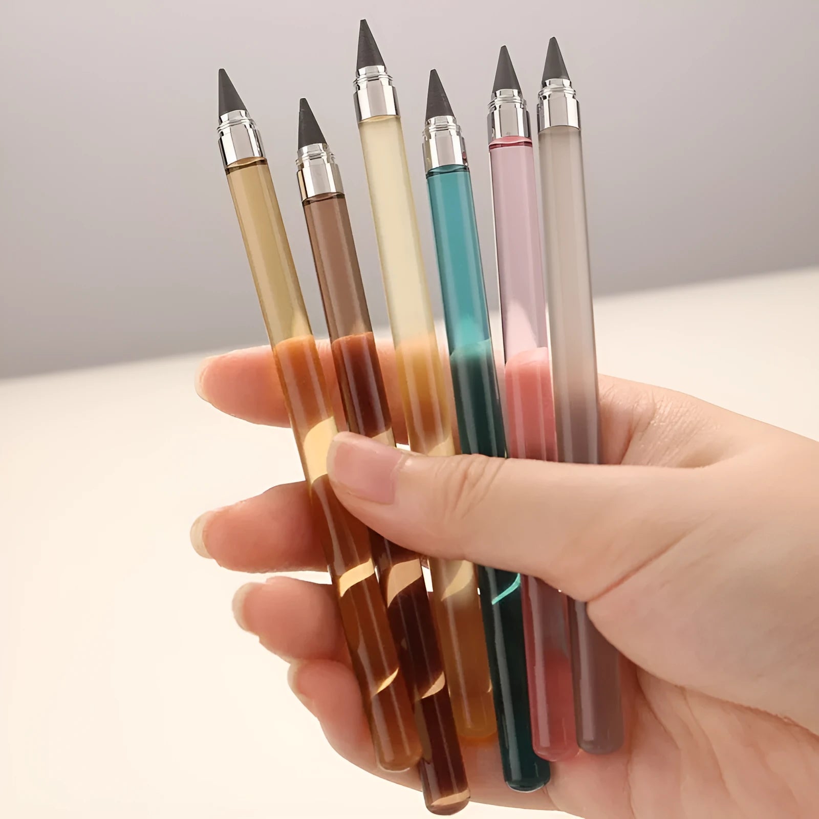 Transparent acrylic mechanical pencil with alloy tip showing internal lead mechanism