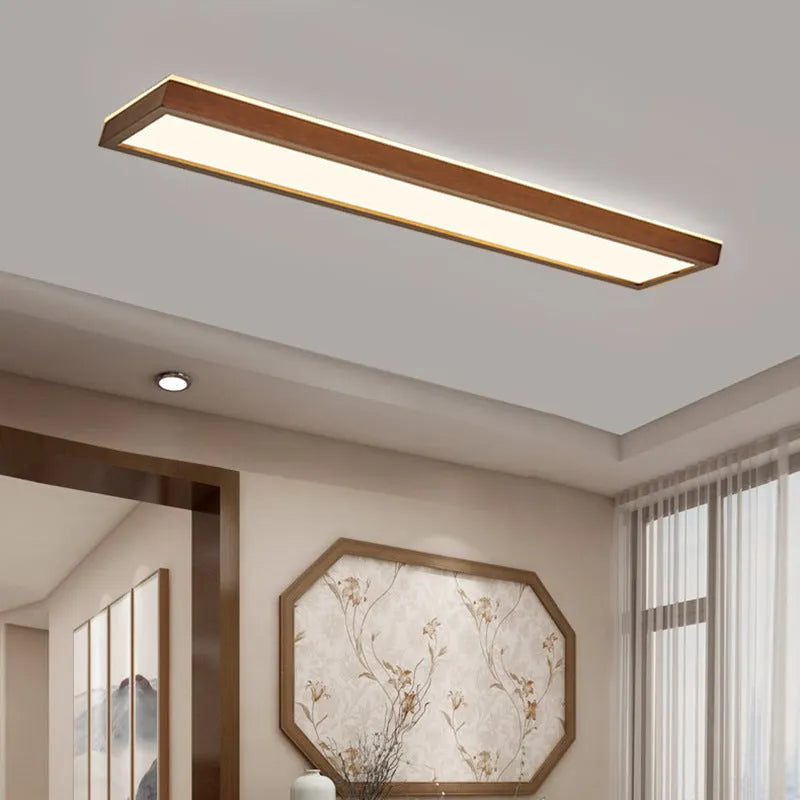 A long, linear solid wood ceiling lamp in New Chinese style, shown in a walnut finish, hanging from a covered balcony ceiling.