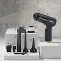 Black wireless handheld car vacuum cleaner with multiple nozzle attachments on a plain background