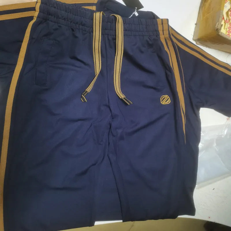 Man wearing a blue short sleeve sports suit set made from ironing-free polyester ice silk style fabric.