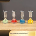 Transparent glass tobacco pipe in trumpet shape measuring 7cm, available in four colours