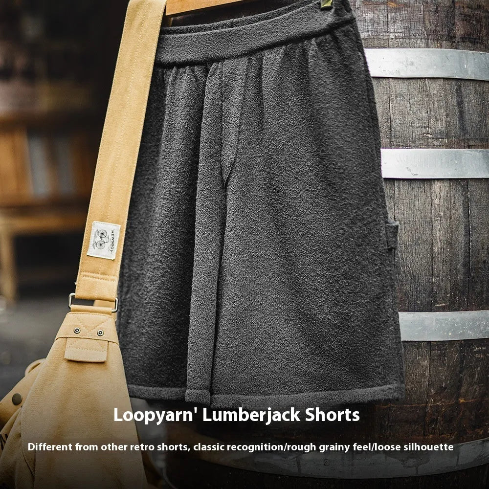 Cement grey straight leg sports shorts with an elastic waistband on a mannequin