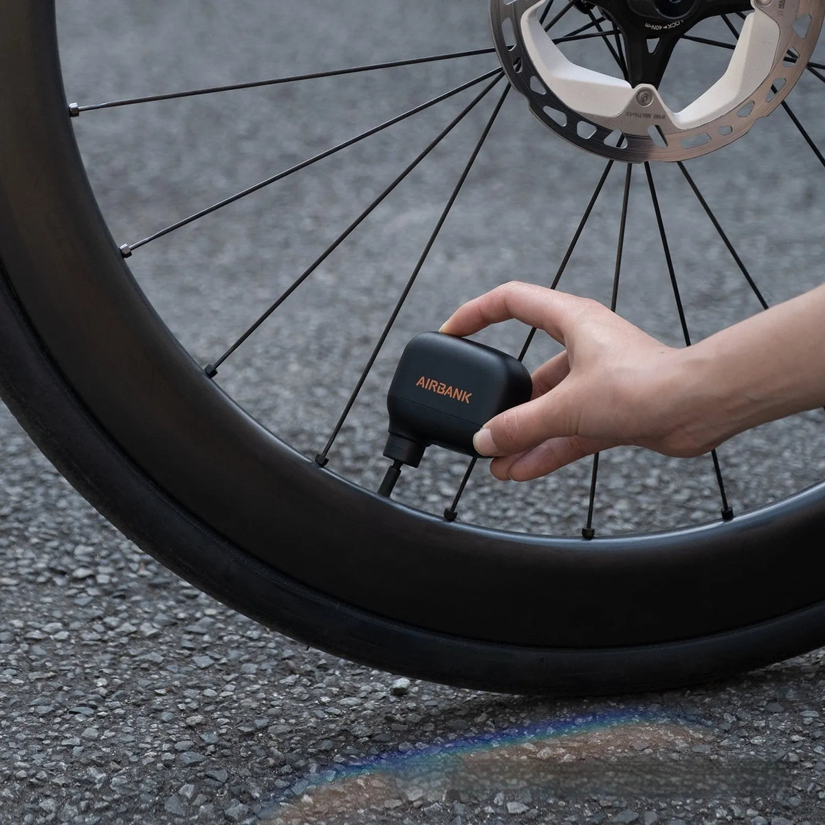 Black USB rechargeable electric bicycle tyre inflator pump with compact dimensions