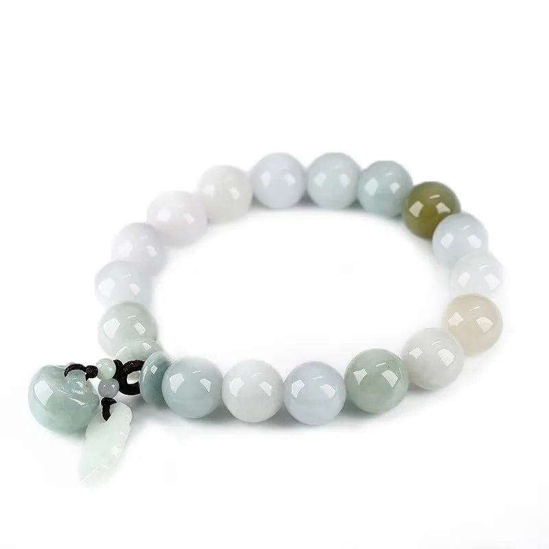 Natural green jade bracelet with a geometric hanging pendant showing choice of symbolic designs.