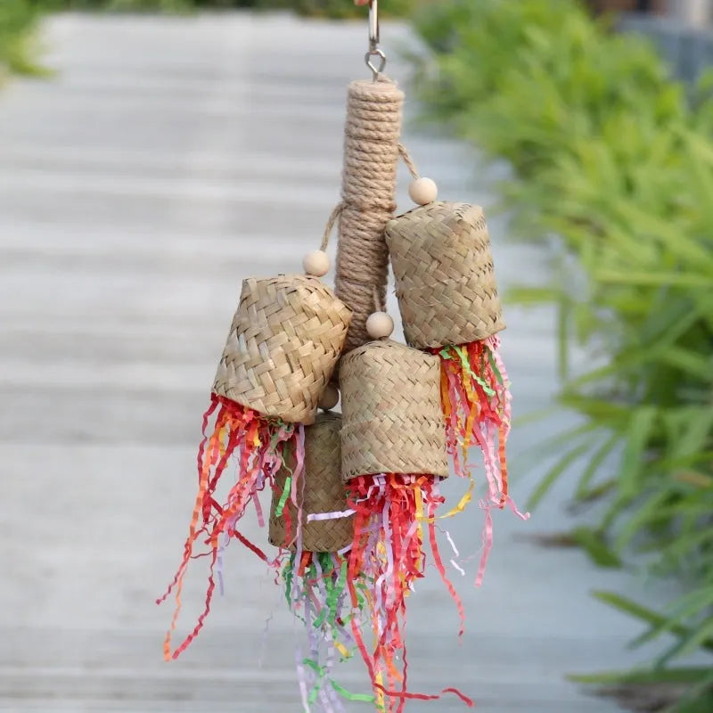 Colourful shredded paper parrot toy with wood and sisal construction hanging