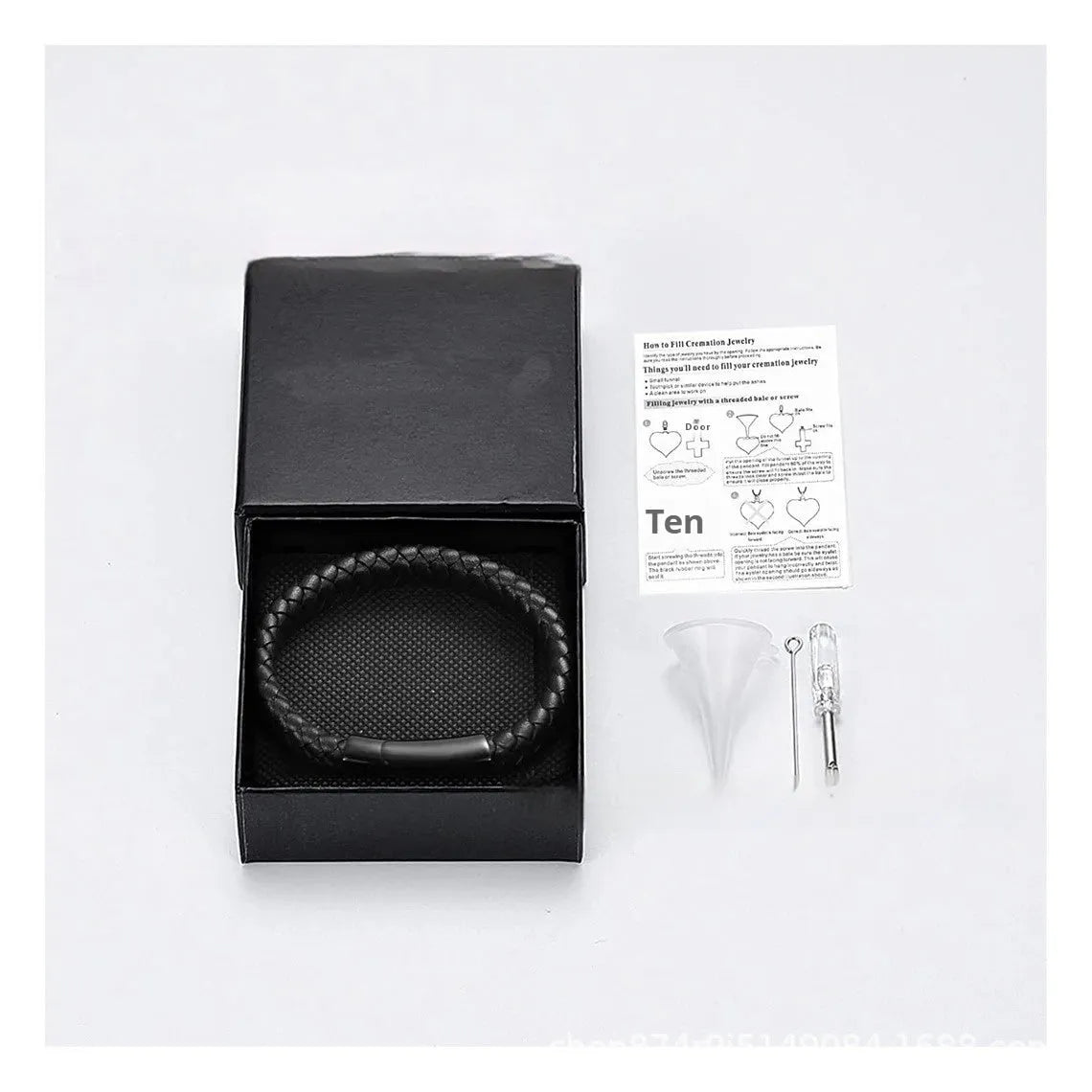 Black leather cord bracelet with woven stainless steel casket pendant.