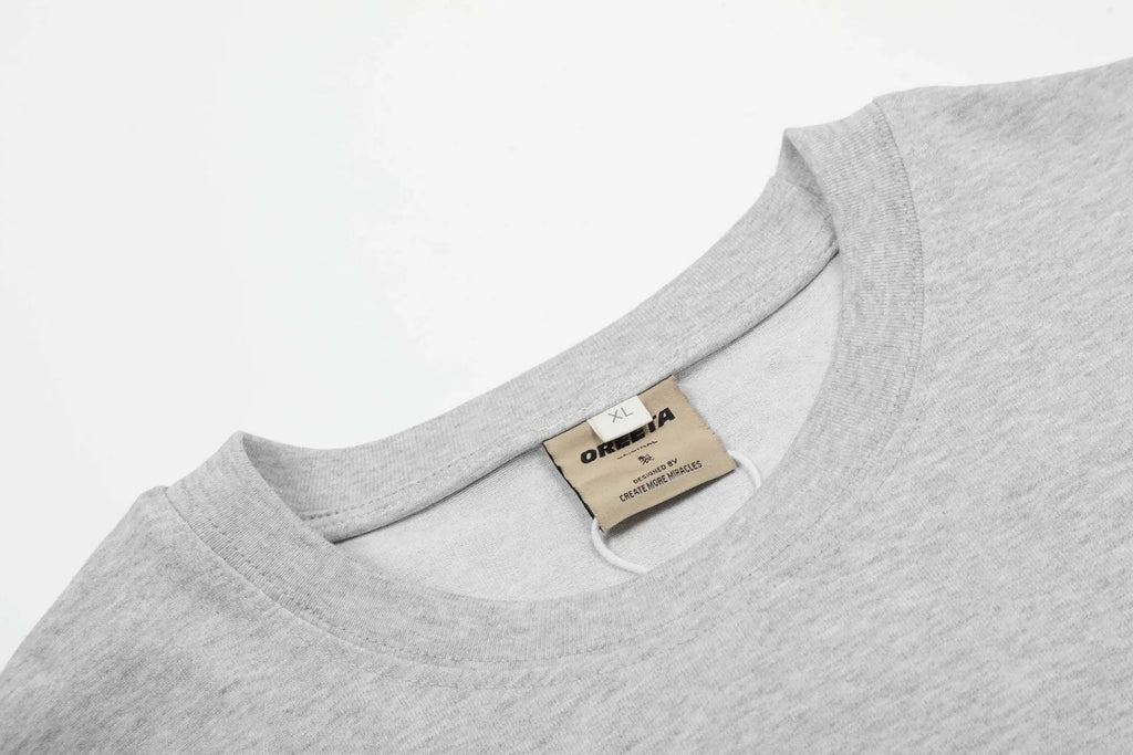 Man wearing a loose-fitting black long sleeve cotton t-shirt with a retro casual style.