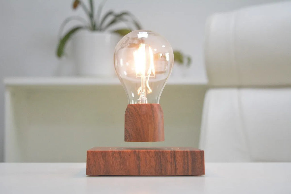Magnetic levitation floating light bulb with imitation wood base and glass enclosure