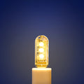 Small white USB LED baby night light showing warm and white light colour options.
