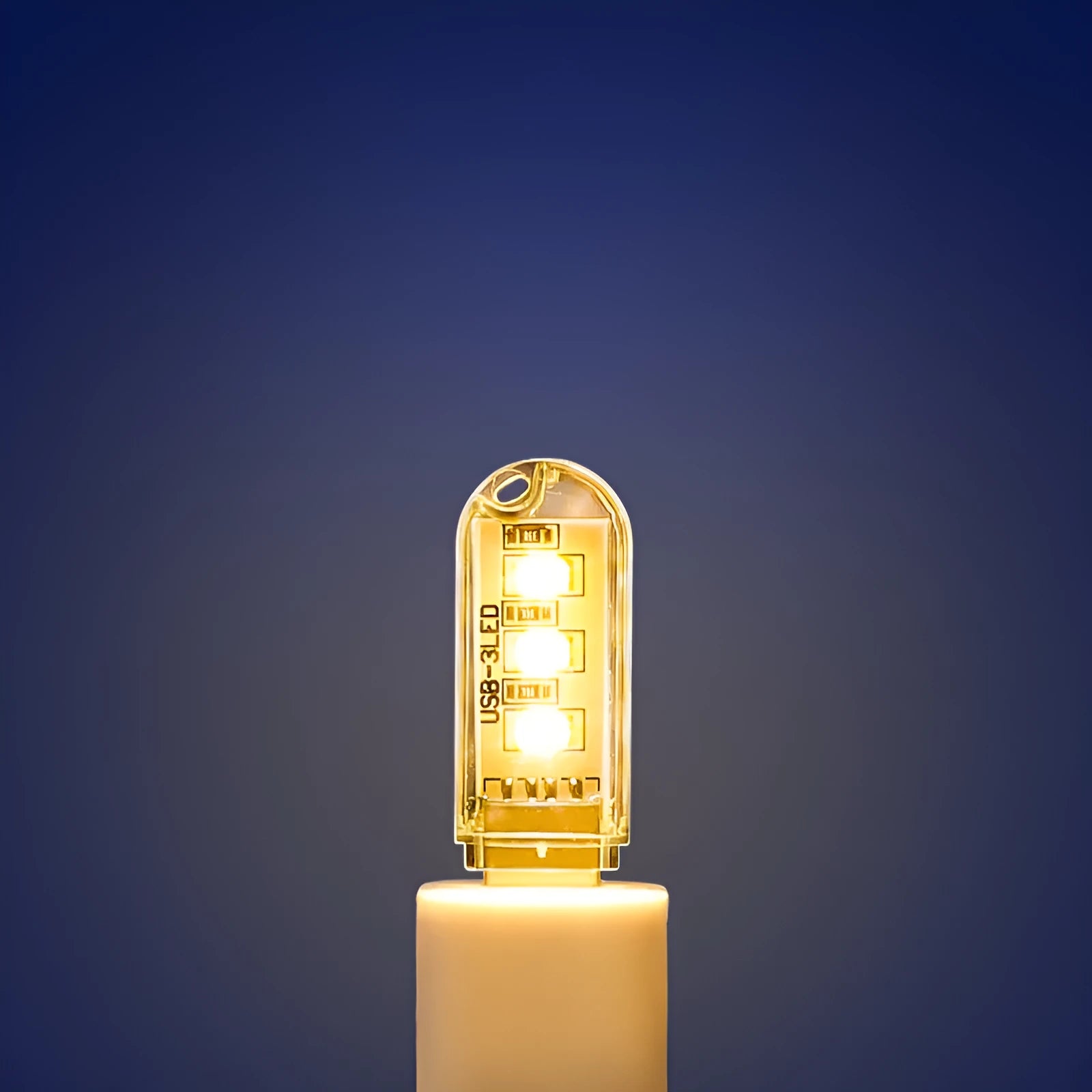 Small white USB LED baby night light showing warm and white light colour options.