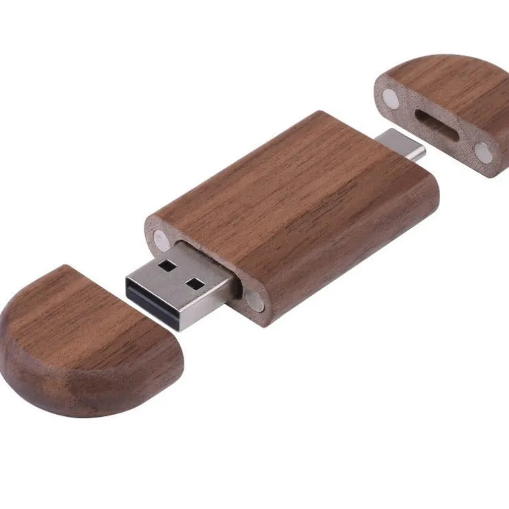 Maple wooden flash drive with USB and TYPE-C connectors on a wooden surface.